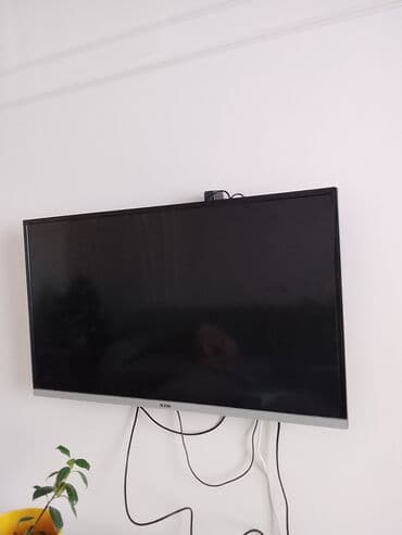 Телевизор DLEDSK (бренд и логотип на рамке). Плоская LED‑панель