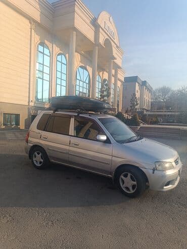 домкрат гидравлический для вытяжки авто: Mazda Demio: 2001 г., 1.3 л, Автомат, Бензин — 6