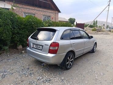 опел зафира б: Mazda 323: 2001 г., 1.6 л, Механика, Бензин, Хэтчбэк — 6