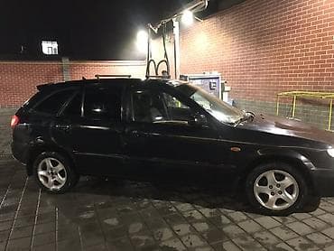 bmw e34 1995: Mazda Familia: 2001 г., Универсал — 2
