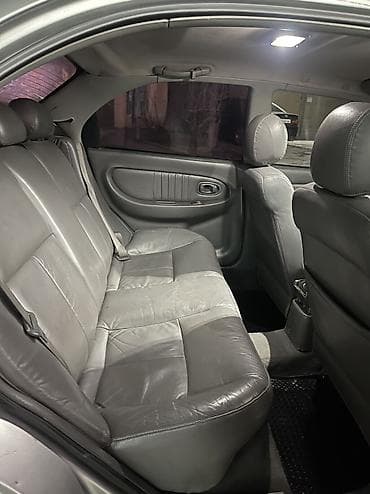 e53 4 8: Kia Shuma: 2002 г. — 6