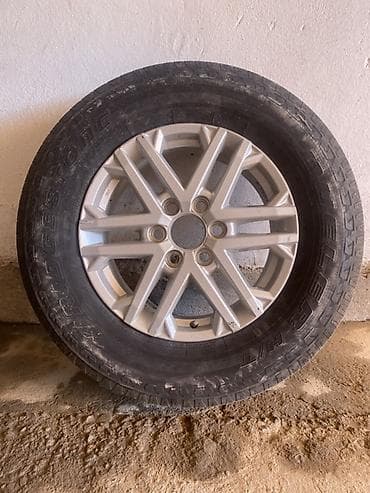 70: 2 штуки оригинальных литых дисков Toyota Tundra с шинами 265/70 R18 — 1