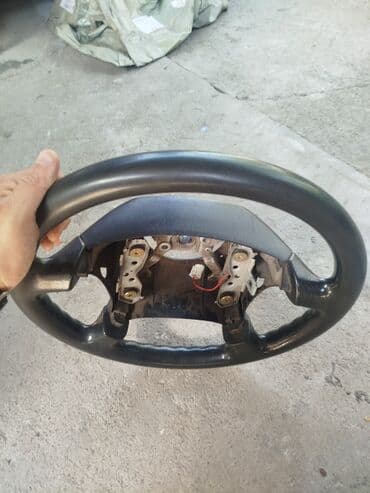 швейная машина для шитья кожи: Руль Mazda 2000 г. — 2