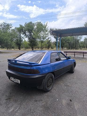 обмен на сапок: Mazda 323: 1994 г., 1.8 л, Механика, Бензин, Хэтчбэк — 5