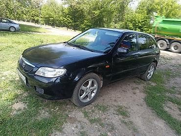 моторчик печки 124: Mazda 323: 2001 г., 2 л, Механика, Бензин, Хэтчбэк — 4