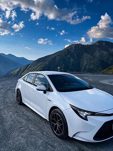 byd e2 2019: Toyota Corolla: 2023 г., 1.8 л, Вариатор, Гибрид, Седан — 2