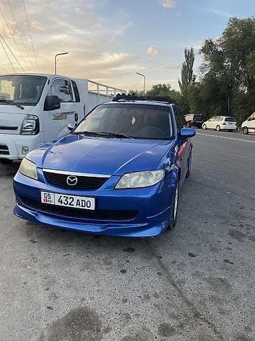 Mazda 323: 2002 г., 1.6 л, Кол менен иштөөчү, Бензин, Хетчбек — 1
