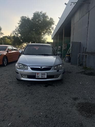 Mazda 323: 2001 г., 1.5 л, Механика, Бензин, Седан