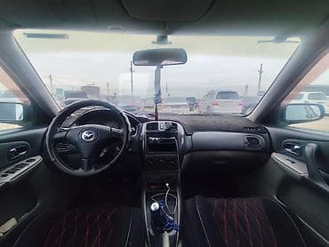 bme e34: Mazda Familia: 2002 г., 1.6 л, Ручные, Универсал — 2