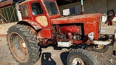 другой: Трактор колесный, класс тяги около 1,4–2,0. Кабина закрытая — 2