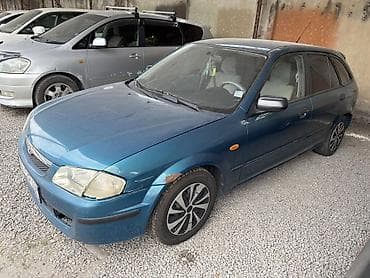 Mazda 323: 1999 г., 1.5 л, Механика, Бензин, Универсал