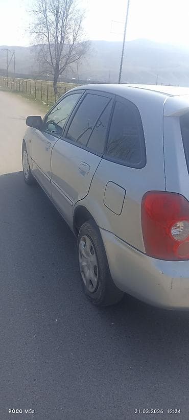 chery tiggo: Mazda 323: 2003 г., 1.6 л, Ручные, Бензин, Хэтчбэк — 9