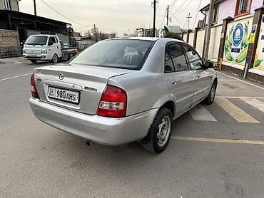 golf variant: Mazda 323: 2002 г., 1.6 л, Механика, Бензин, Седан — 5