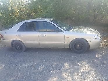 kia pegas: Mazda 323: 2001 г., 1.8 л, Механика, Седан — 3