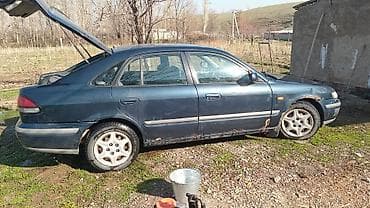 выхлоп банка: Mazda 626: 1999 г., 1.8 л, Ручные, Лифтбек — 2