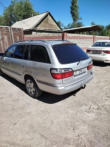 глушитель на макси: Mazda 626: 1998 г., 1.8 л, Механика, Бензин, Универсал — 2