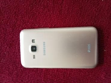 Samsung Galaxy J1, Б/у, цвет - Золотой, 2 SIM