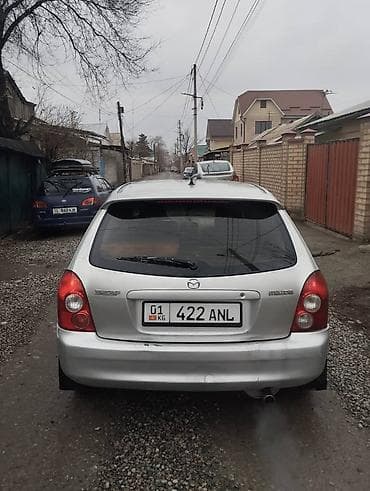 Mazda 323: 2003 г., Механика, Универсал