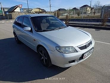Унаа: Mazda 323: 2001 г., 1.6 л, Кол менен иштөөчү, Бензин, Хетчбек — 1