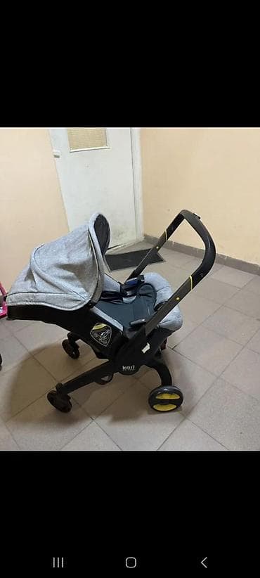 балдар машинасы: Детская коляска‑автолюлька (формат Doona/каркас «коляска‑кресло») — 3