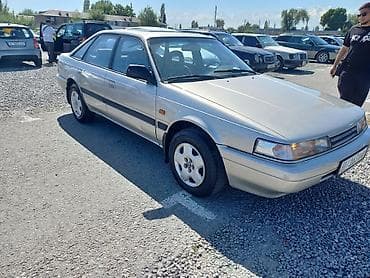 crown 2002: Mazda 626: 1991 г., 2 л, Механика, Бензин, Лифтбек — 1