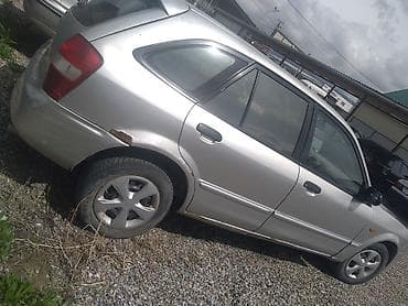 тюнинг авто: Mazda Familia: 2001 г., Механика, Бензин, Хэтчбэк — 1