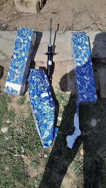 Башка унаа тетиктери: Арткы амортизатор Nissan 2002 г., Германия — 1