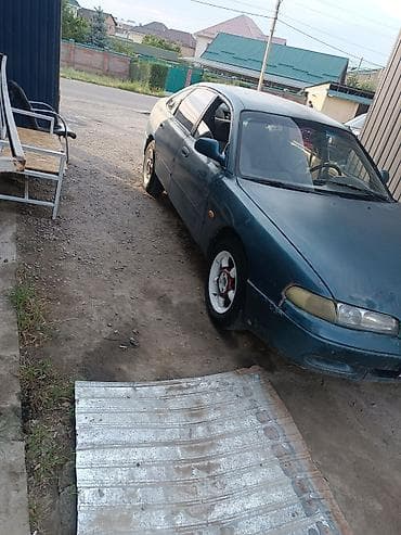 Mazda 323: 1994 г., 1.8 л, Механика, Бензин, Седан — 1