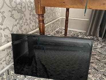 колонки 5 1: Телевизор NISVA с диагональю около 32–37". Плоская LED‑панель — 3