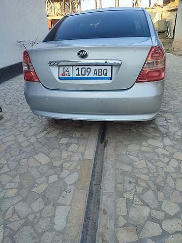 глушитель для нексия: Седан серебристого цвета с тонированными задними стеклами — 7