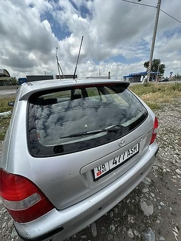 с люком: Mazda 323: 1999 г., Механика, Бензин, Хэтчбэк — 5
