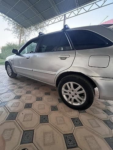 велоприцеп для детей: Mazda Familia: 2002 г., 1.6 л, Механика, Бензин, Универсал — 4