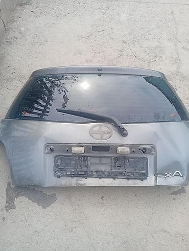 Стекло заднее Scion xA (хэтчбек). Тойота Ист задний бампер под