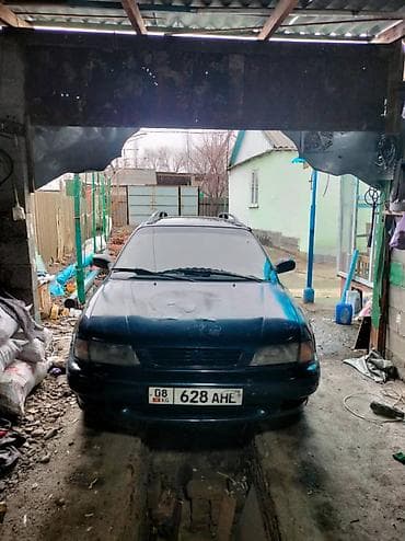 Продаётся легковой автомобиль универсал темно-зелёного цвета Сузуки