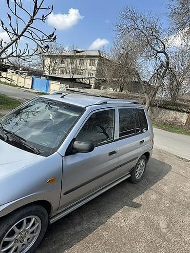 step vagon: Mazda Demio: 2003 г., 1.3 л, Ручные, Бензин, Универсал — 5
