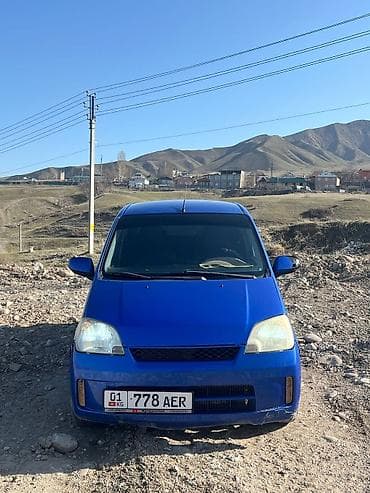 golf 2: Daihatsu Cuore: 2003 г., Автомат, Бензин, Хэтчбэк — 4