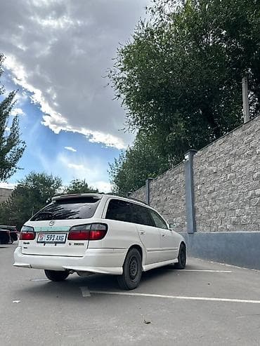 200000 автомат: Mazda Capella: 2000 г., Механика, Бензин, Универсал — 1