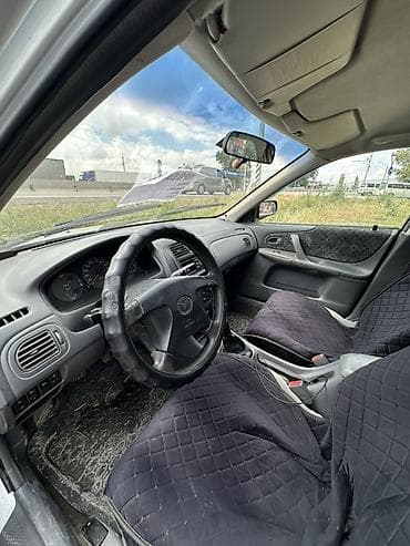 с люком: Mazda 323: 1999 г., Механика, Бензин, Хэтчбэк — 6