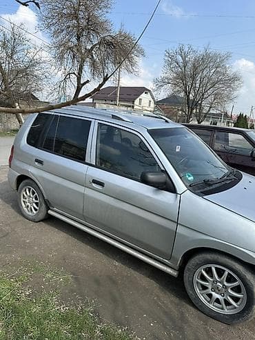 step vagon: Mazda Demio: 2003 г., 1.3 л, Ручные, Бензин, Универсал — 4