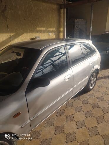 чехол нексия 1: Mazda 323: 2003 г., 1.6 л, Механика, Хэтчбэк — 1