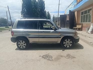 авто жаз: Mitsubishi Pajero: 2003 г., 2 л, Кол менен иштөөчү, Бензин, Жол тандабас — 6