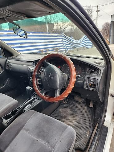 diska 14: Nissan Bluebird: 1997 г., Автомат, Бензин, Седан — 7