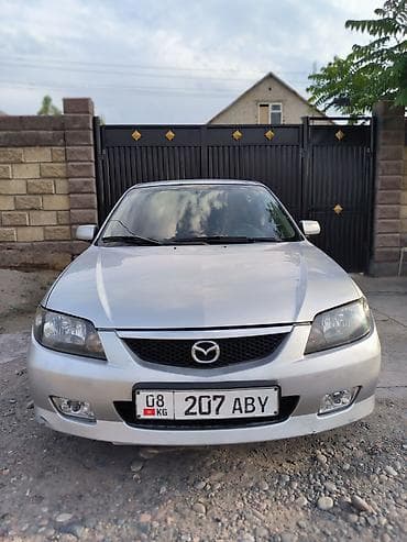 Mazda 323: 2003 г., 2 л, Кол менен иштөөчү, Газ, Хетчбек — 10