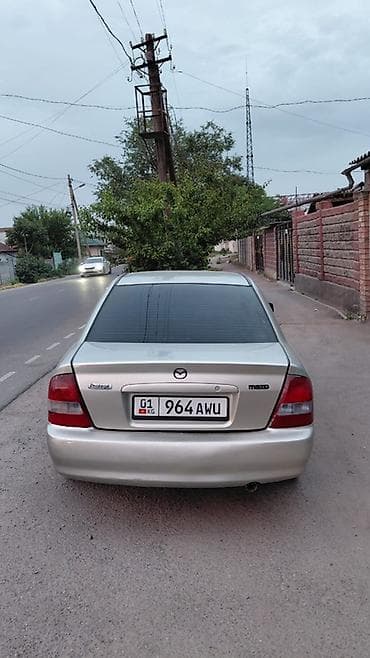 авто крепеж: Mazda Protege: 2001 г., Автомат, Бензин, Седан — 3