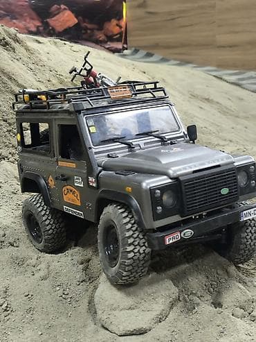 автомобильная рация: Радиоуправляемый внедорожник Land Rover Defender 90 (масштаб 1:12) - — 4