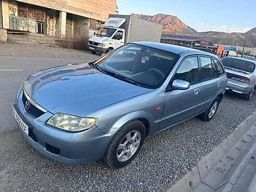 Транспорт: Mazda 323: 2001 г., 1.6 л, Механика, Бензин, Универсал — 1
