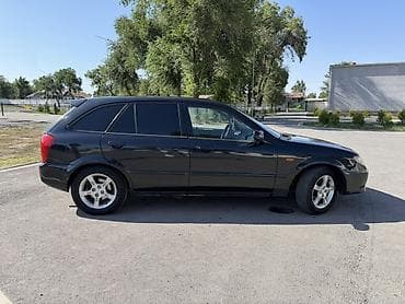 авто кытай: Mazda 323: 2002 г., 1.6 л, Механика, Бензин, Хэтчбэк — 5