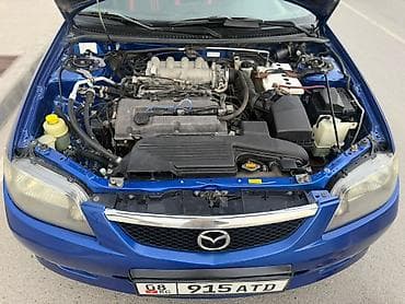 Унаа: Mazda 323: 2003 г., 1.6 л, Кол менен иштөөчү, Бензин, Хетчбек — 6
