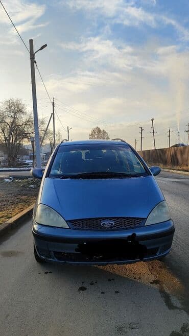 Продажа авто: Просторный 7‑местный минивэн (левый руль), серый металлик. Основные — 6