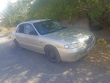 kia pegas: Mazda 323: 2001 г., 1.8 л, Механика, Седан — 4